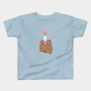 Pile of baggage with a jar with flowers Kids T-Shirt